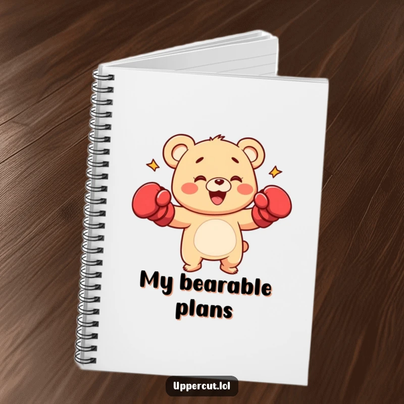 Funny bear cub character with boxing gloves, shown playfully punching, a motivational and humorous notebook.